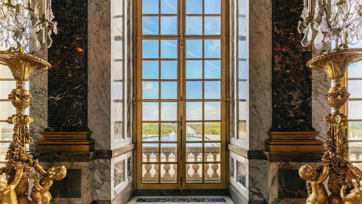Hall of Mirrors inside the Palace of Versailles on a guided coach tour from Paris to Versailles, France