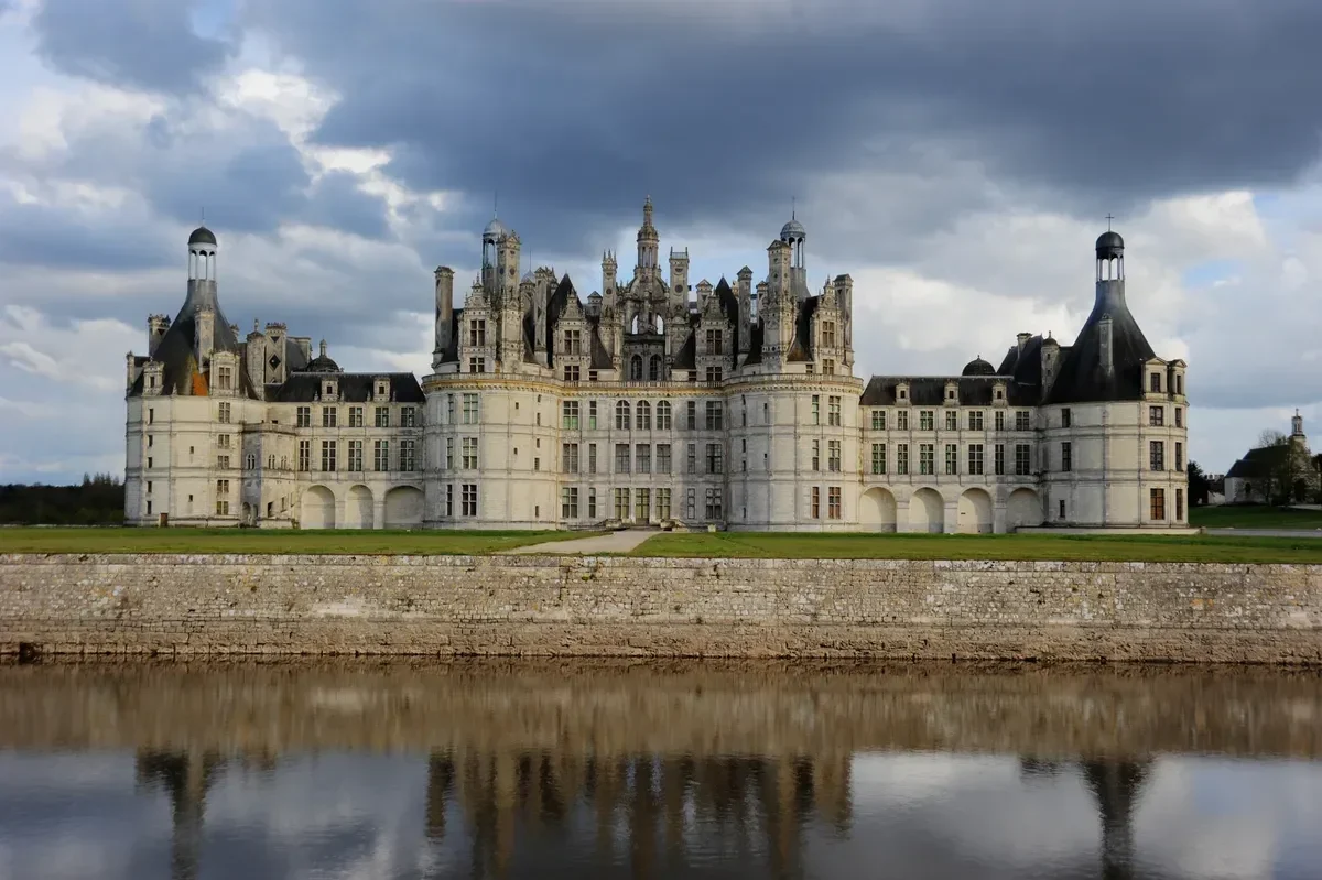 Château de Chambord reflected in its moat on a Loire Valley castles day trip from Paris