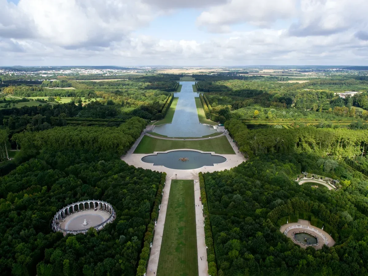 Aerial view of the Grand Canal and Apollo Basin in the Versailles gardens on a bike day tour from Paris